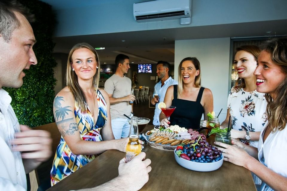 People enjoying themselves in the Dbar at H On Smith Hotel