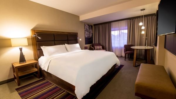 TV & furniture in Executive Room 1 King at FA Hotels & Resorts