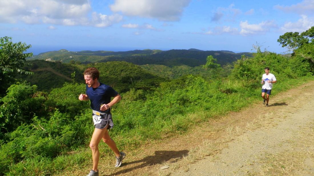 Two runners on a mountain near The Buccaneer Resort St. Croix
