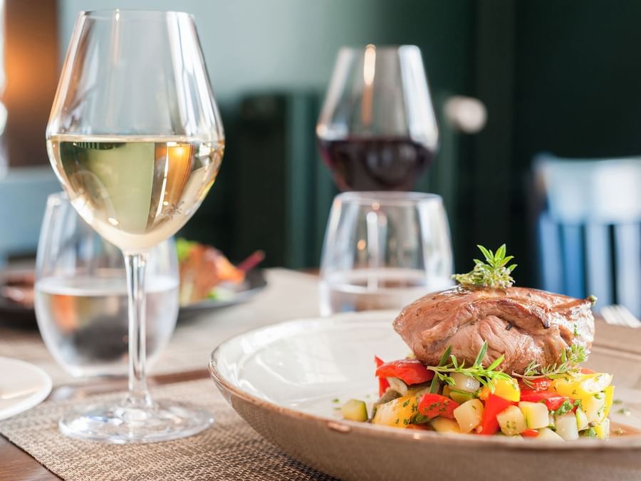 Closeup of Meals served with wine atHotel O Gayot