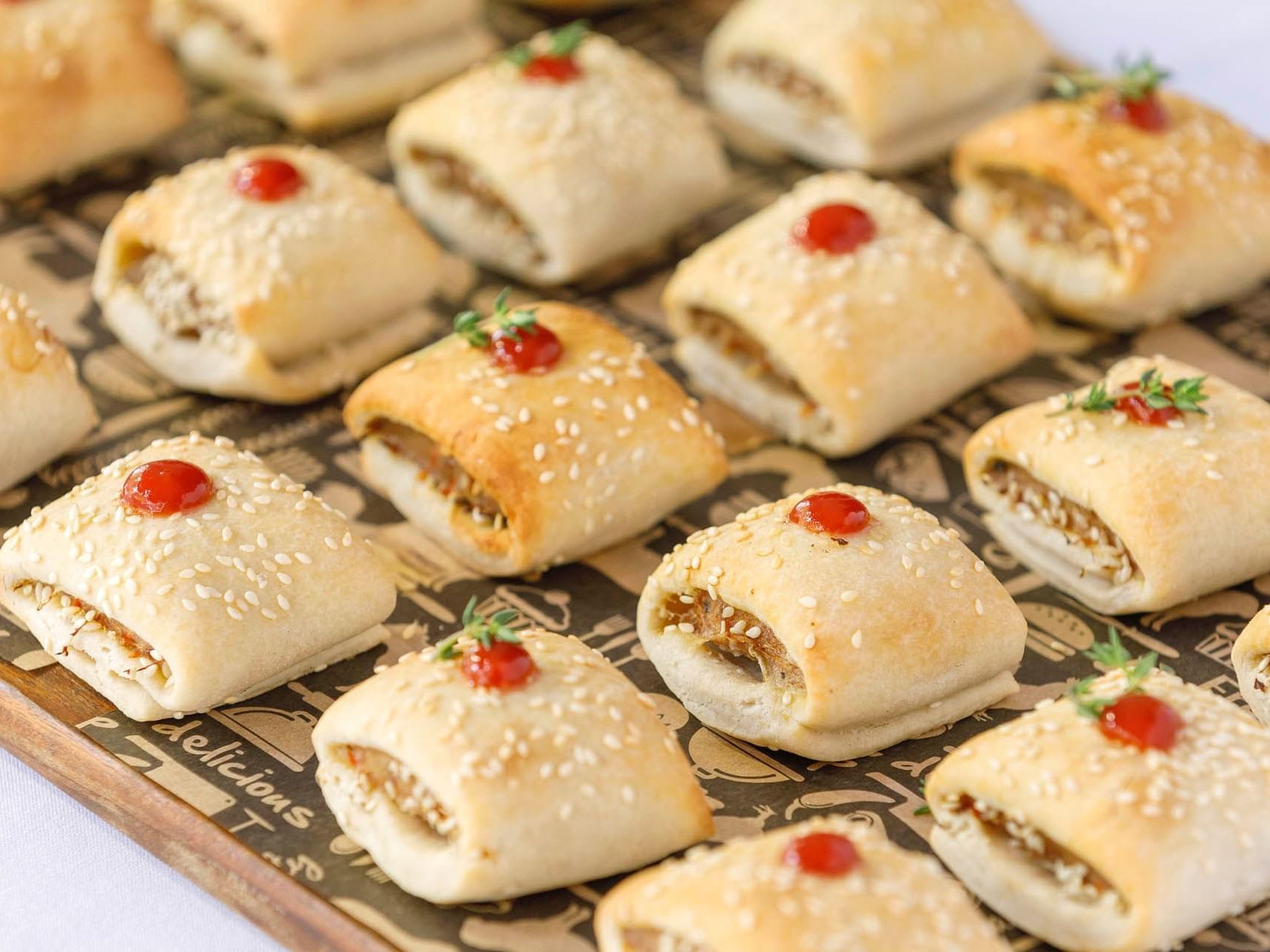 Close-up of mini pastries on a board served at Grand Chancellor Melbourne