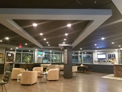 Dining area of Breakfast Room with wooden floors at Merit Hotel & Suites