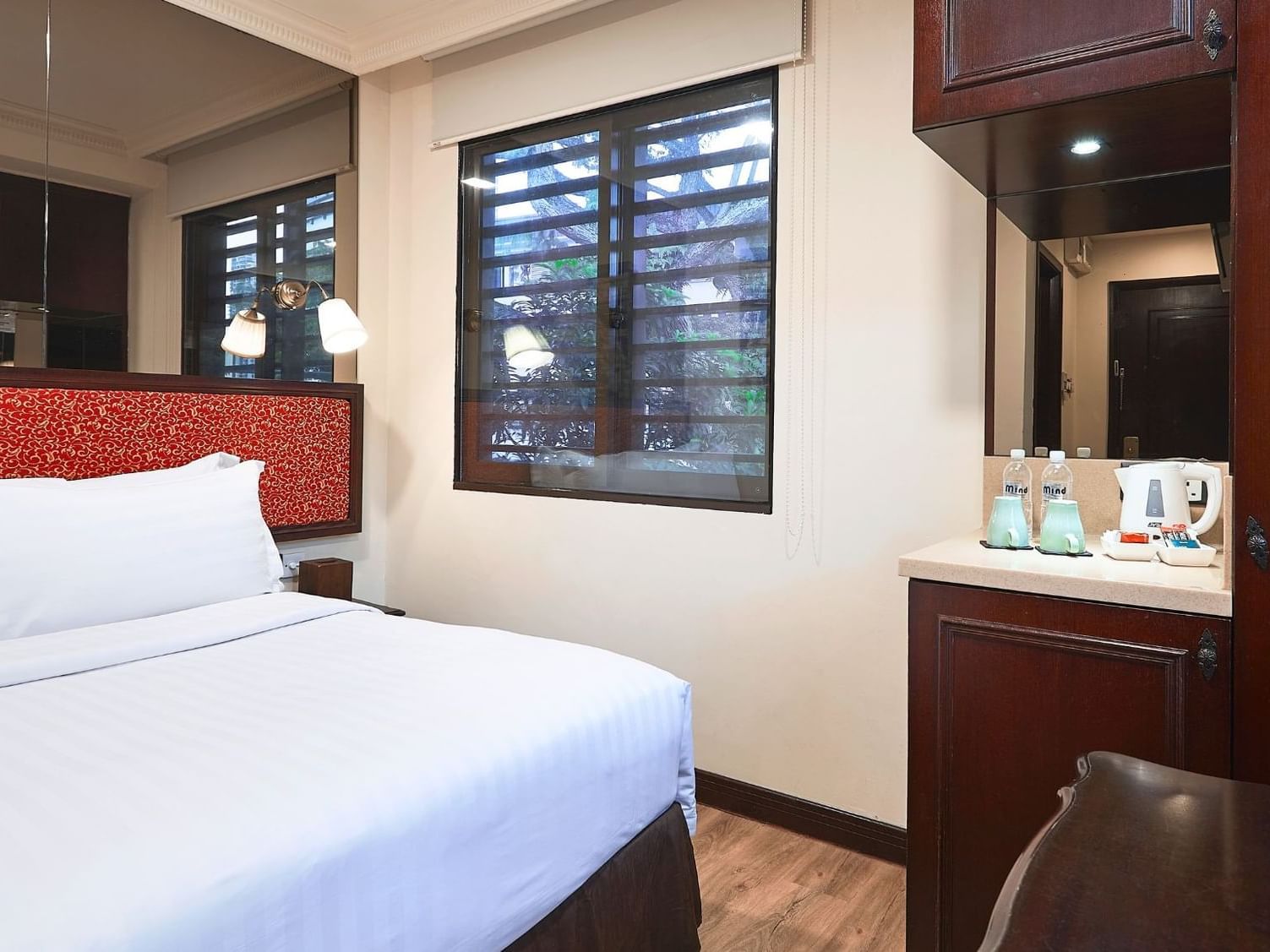 Bed by the window in Superior Room, Nostalgia Hotel Singapore