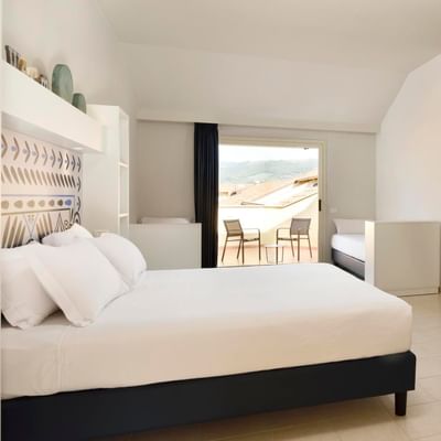 Large bed & desk, Junior Suite Deluxe at Falkensteiner Calabria