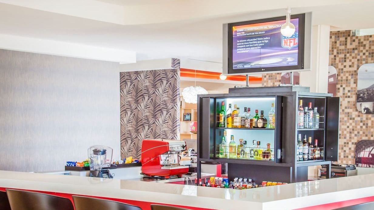 Bar counter with bar chairs in la Isla at Fiesta Inn Hotels