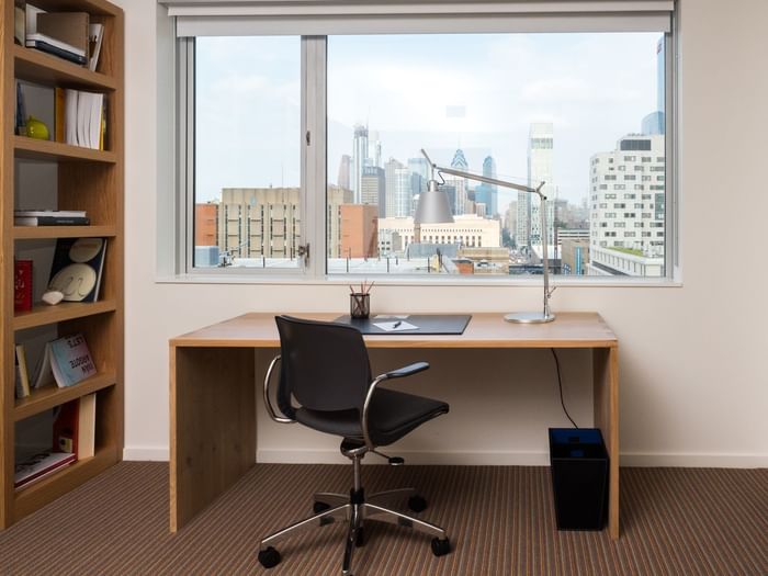 Desk under window with city view