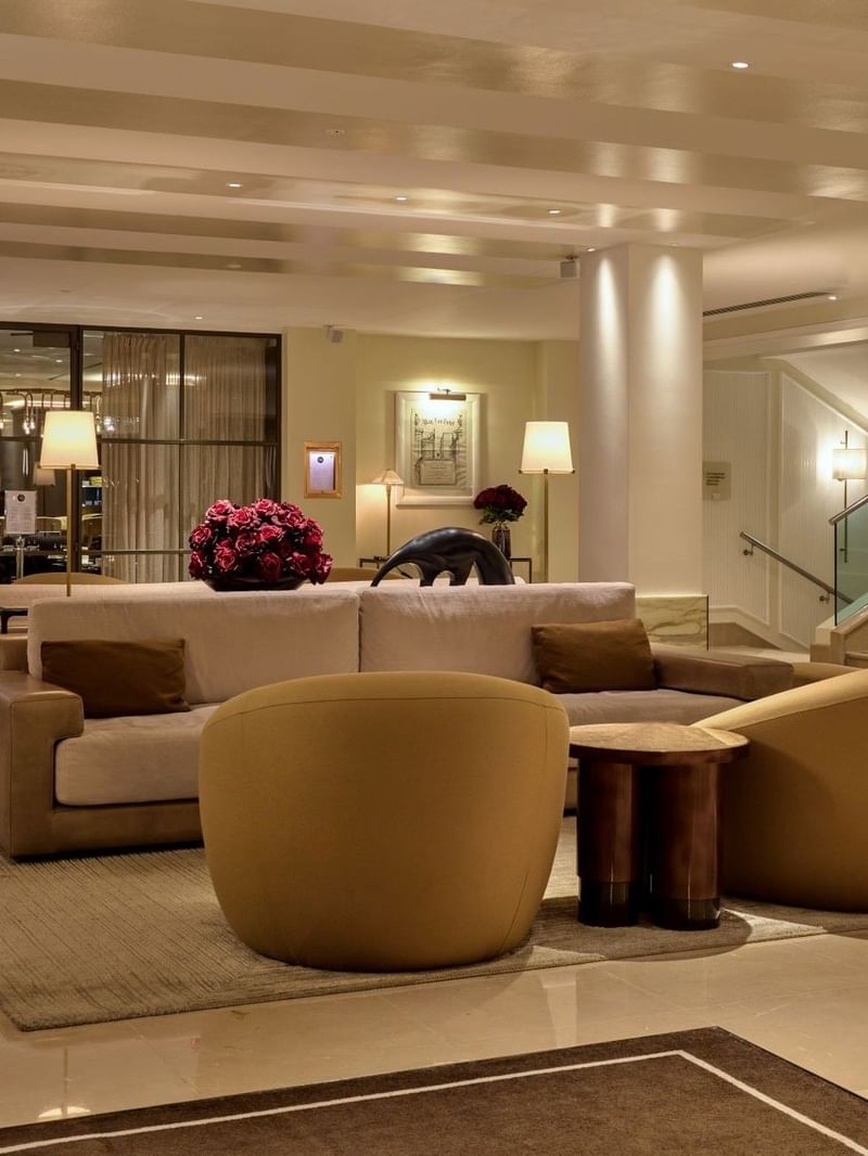Elegant lounge area with plush seating and modern decor at The May Fair Hotel. 