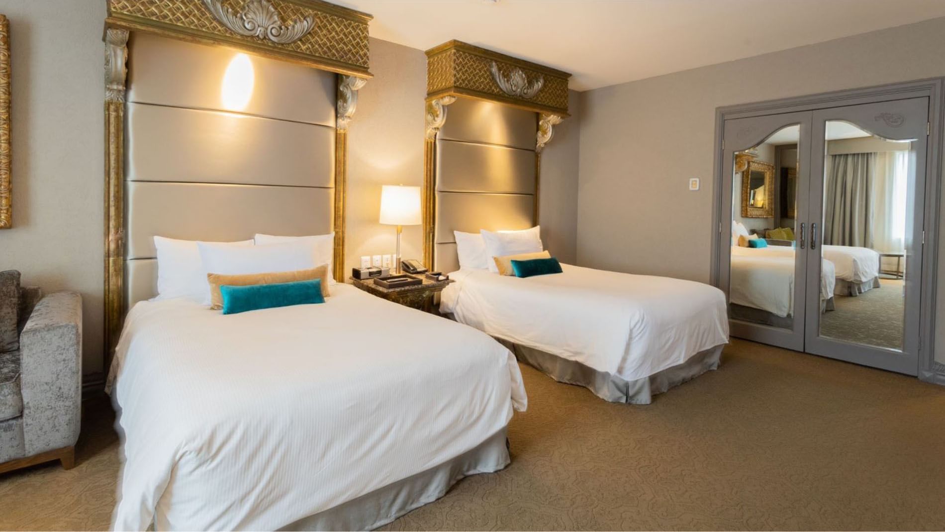 2 Double Grand Class with golden canopies reflecting luxury in a clean and well-lit interior at Quinta Real Monterrey