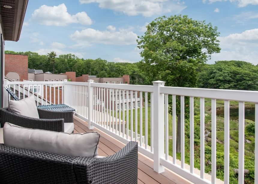 Terrace with comfy sofas and a table at Ogunquit Collection