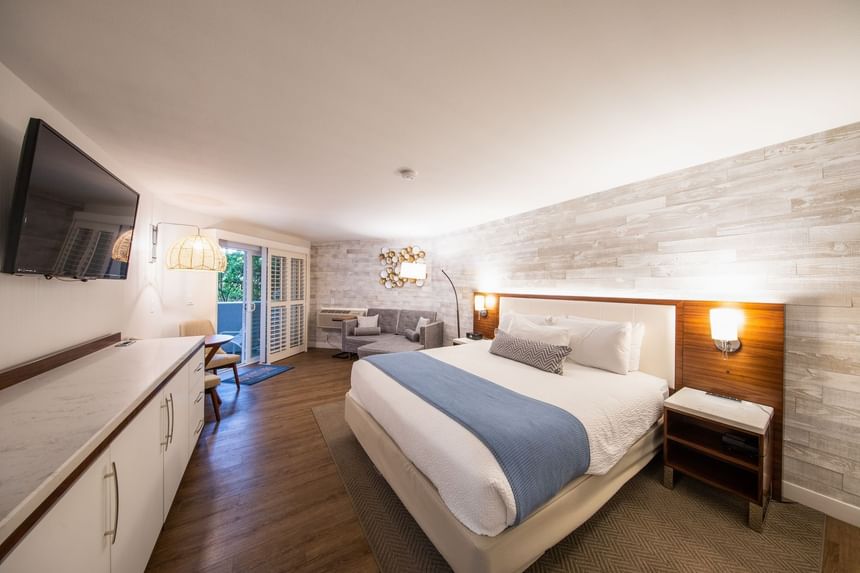 Hotel room with one bed and TV