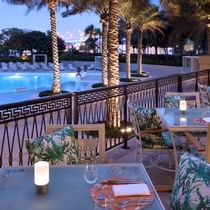 Pool front dining area in Giardino at Palazzo Versace Dubai