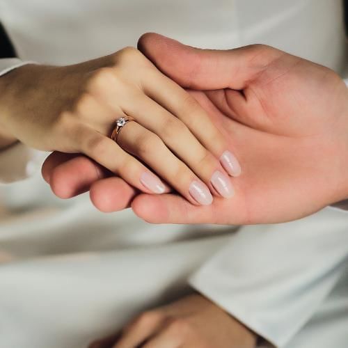 Bride and groom holding hands ready for their grand entrance 