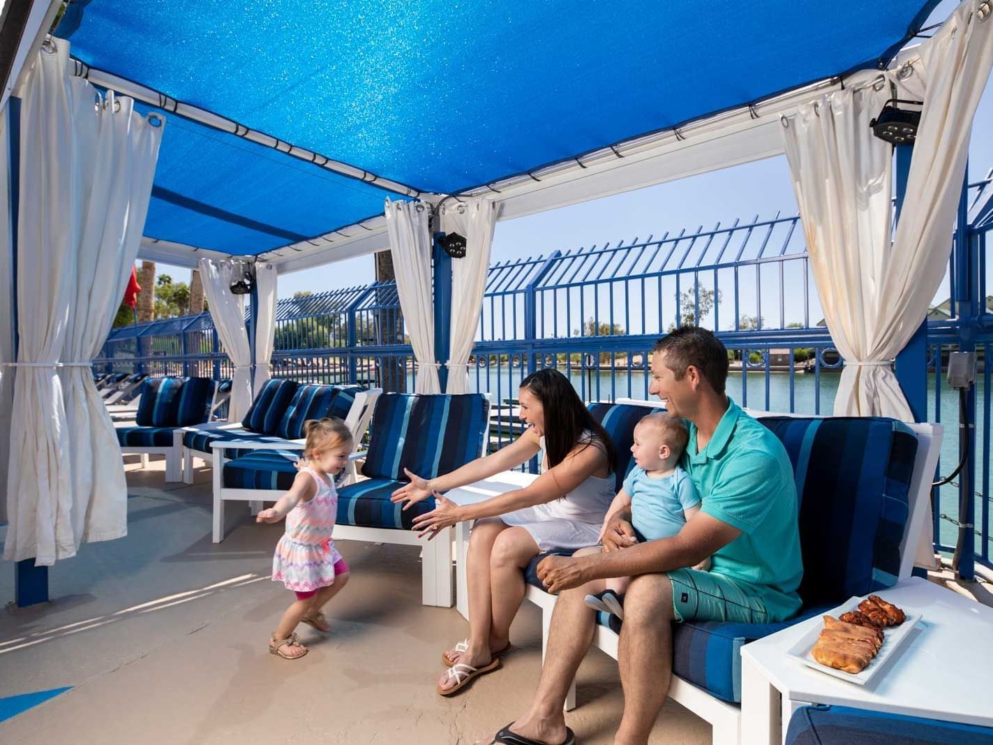 A family enjoying in Kokomo Cabana at London Bridge Resort