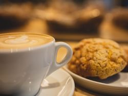 Close-up of baked goods served with coffee at Carlton D Creek