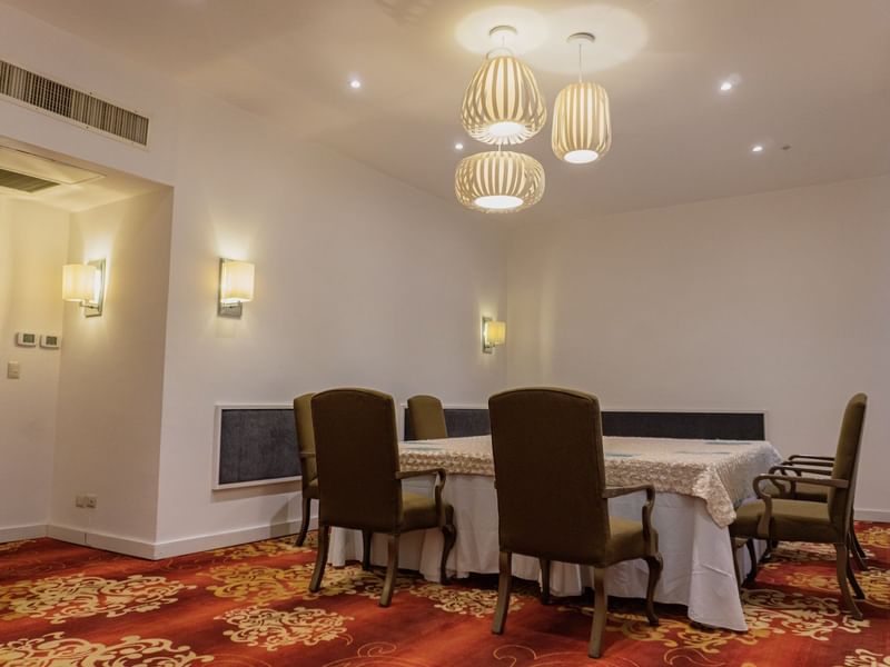 Discussion table and chairs in Don Arturo Room at Gamma Hotels