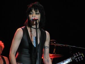 Joan Jett performing on stage at Rosen Inn Universal