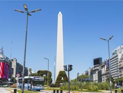 Busy street by the Obelisco near Grand Hotels Lux