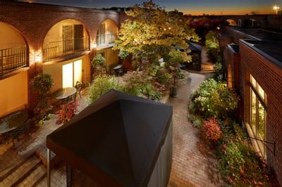 Courtyard with flowers at sunset at The Inn of Waterloo
