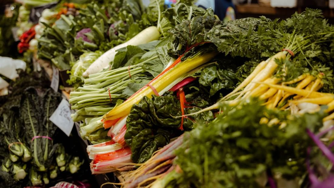 Colorful display of fresh produce and veggies at Carriageworks Farmers Market near Novotel Sydney International Airport