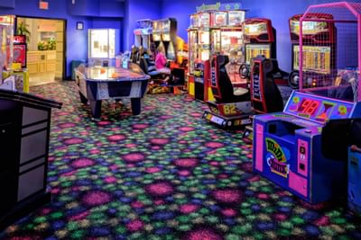 Game room with air hockey, a co-op driving game, basketball