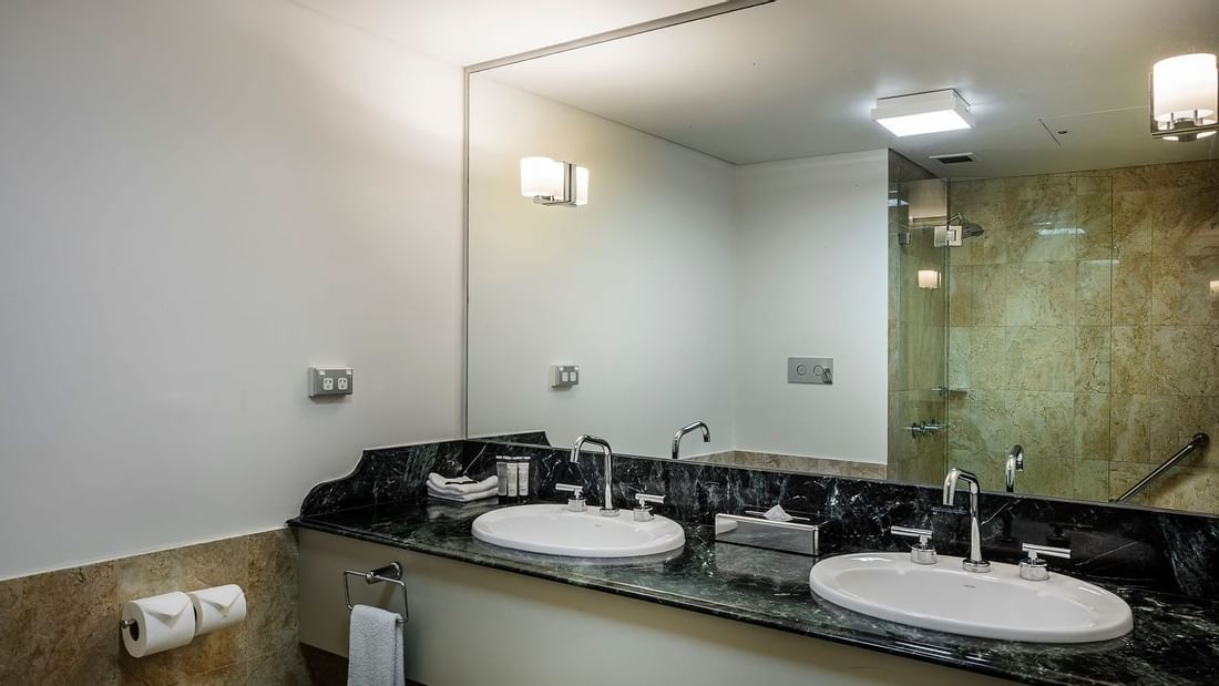 Marbled bathroom vanity area in Balcony Guest Room at Pullman and Mercure King George Square Brisbane