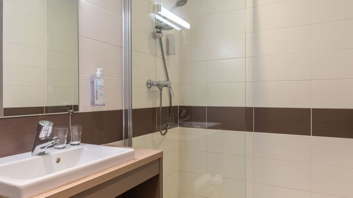 Bathroom vanity in bedrooms at Ara Hotel