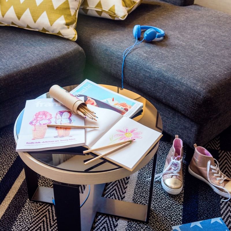 Close-up of a drawing book with colour pencils at Crown Hotels