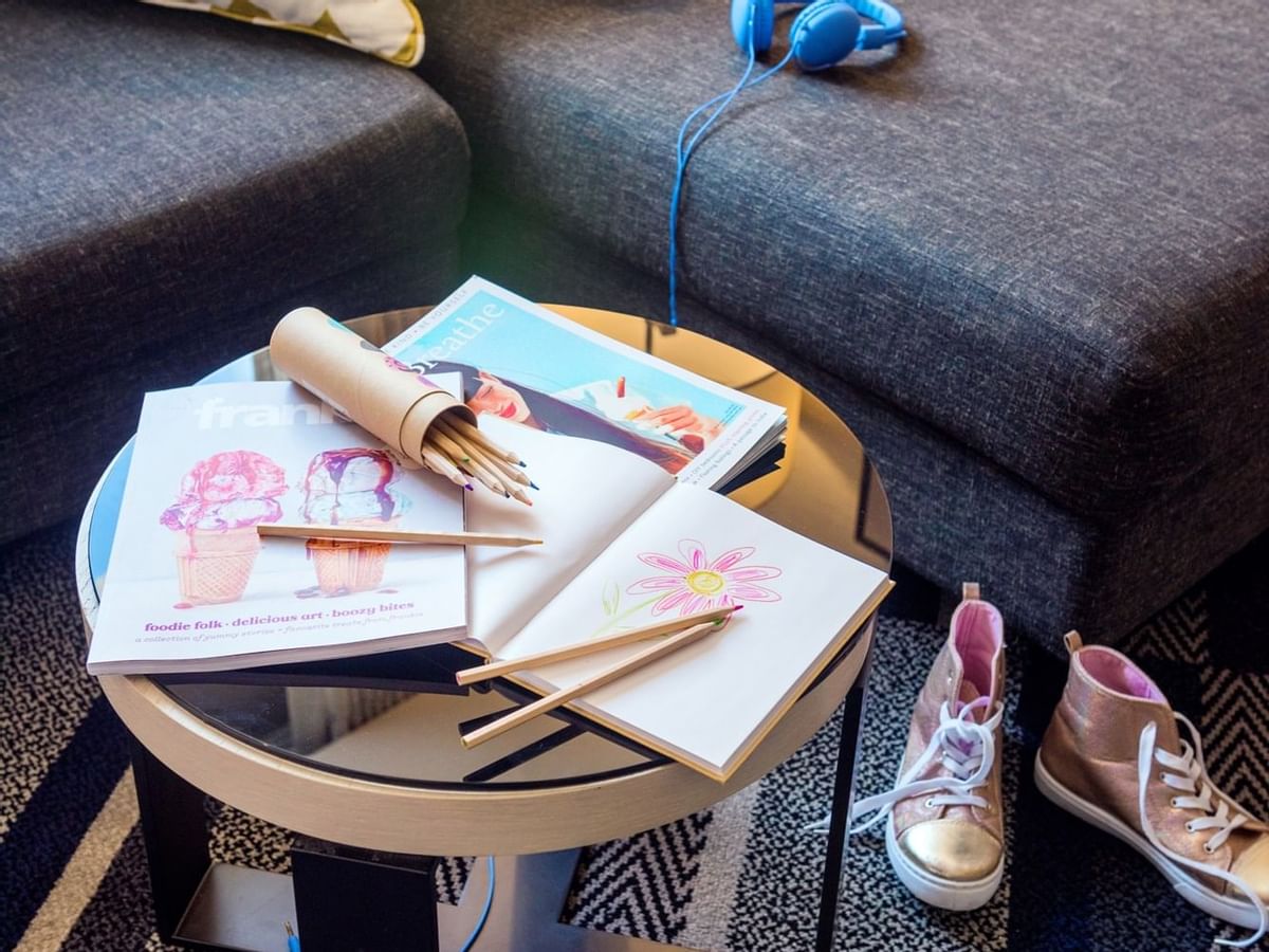 Close-up of a drawing book with colour pencils at Crown Hotels