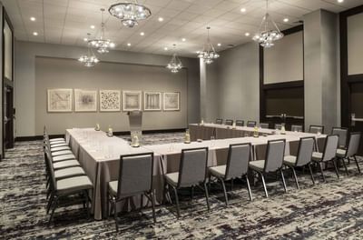 banquet room with u shaped tables and chairs