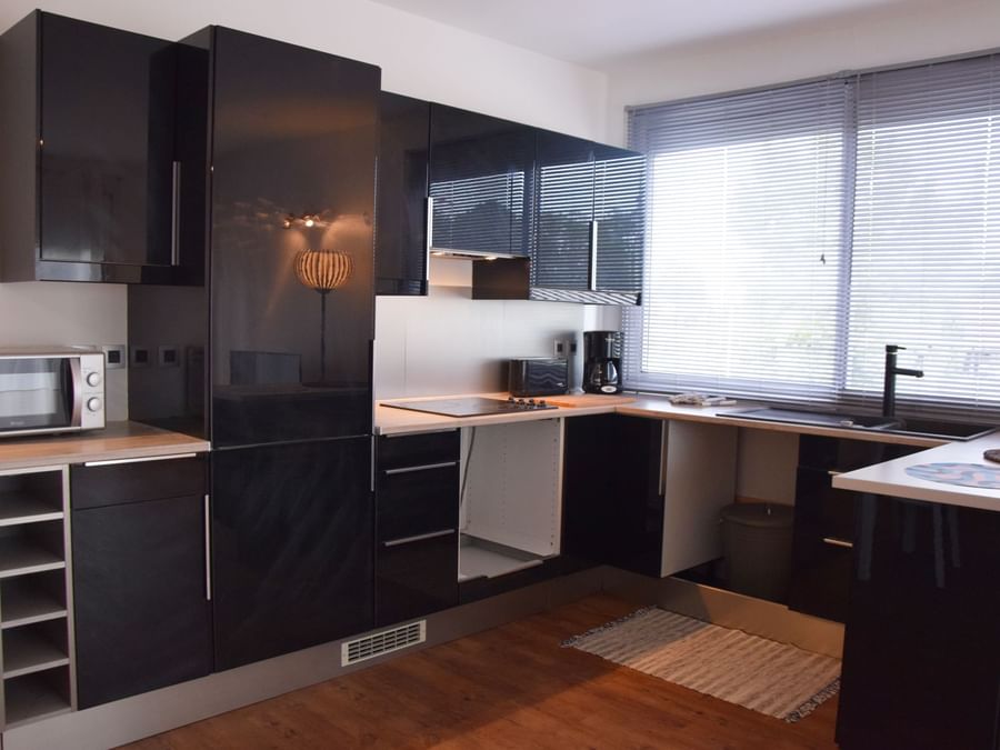 Kitchen in Apartments at The Originals Hotels
