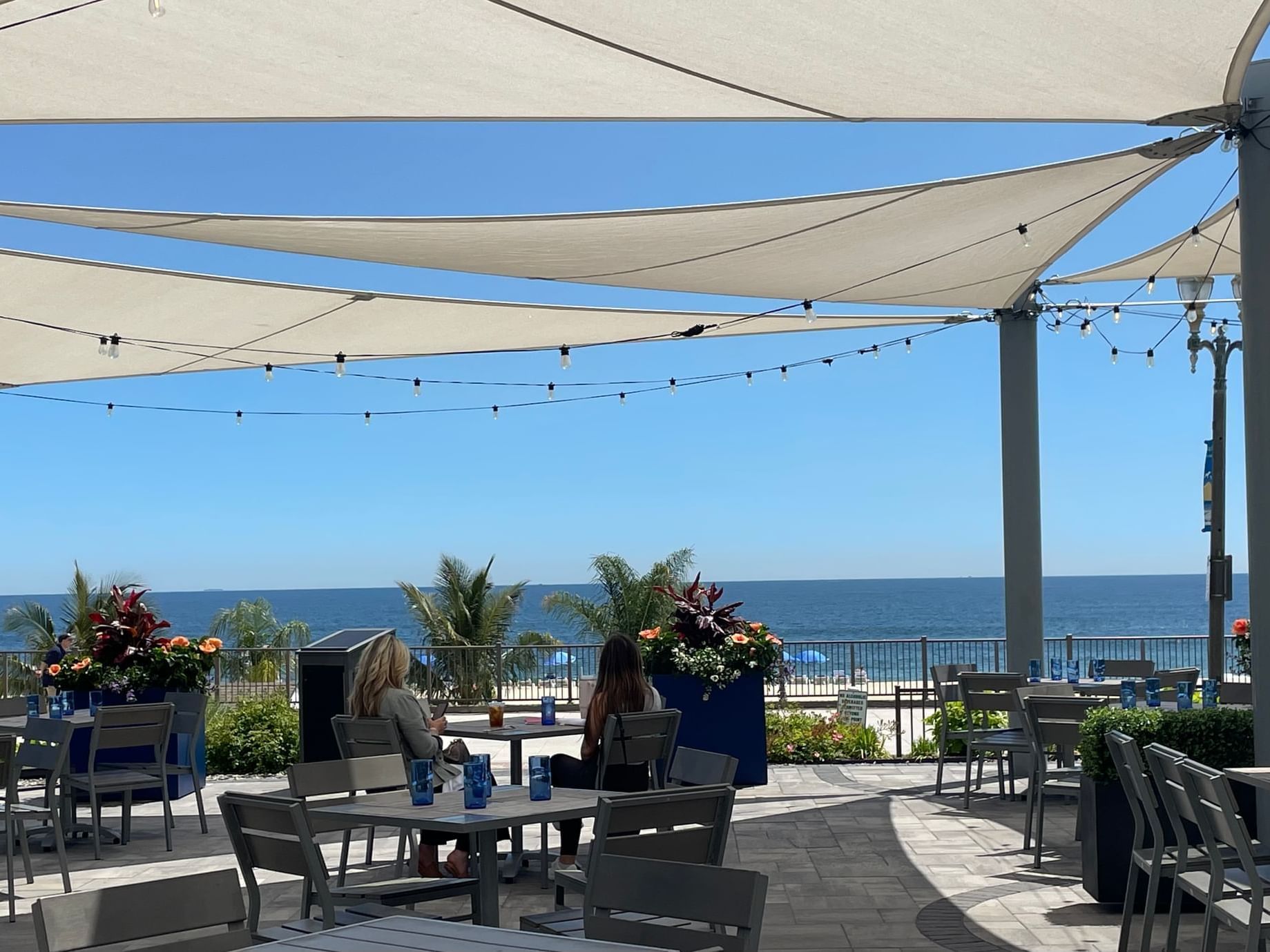 Ladies eating at an outdoor restaurant