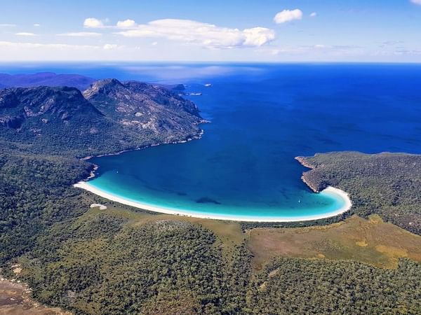 Aerial view of mountains with the Bay near Freycinet Lodge