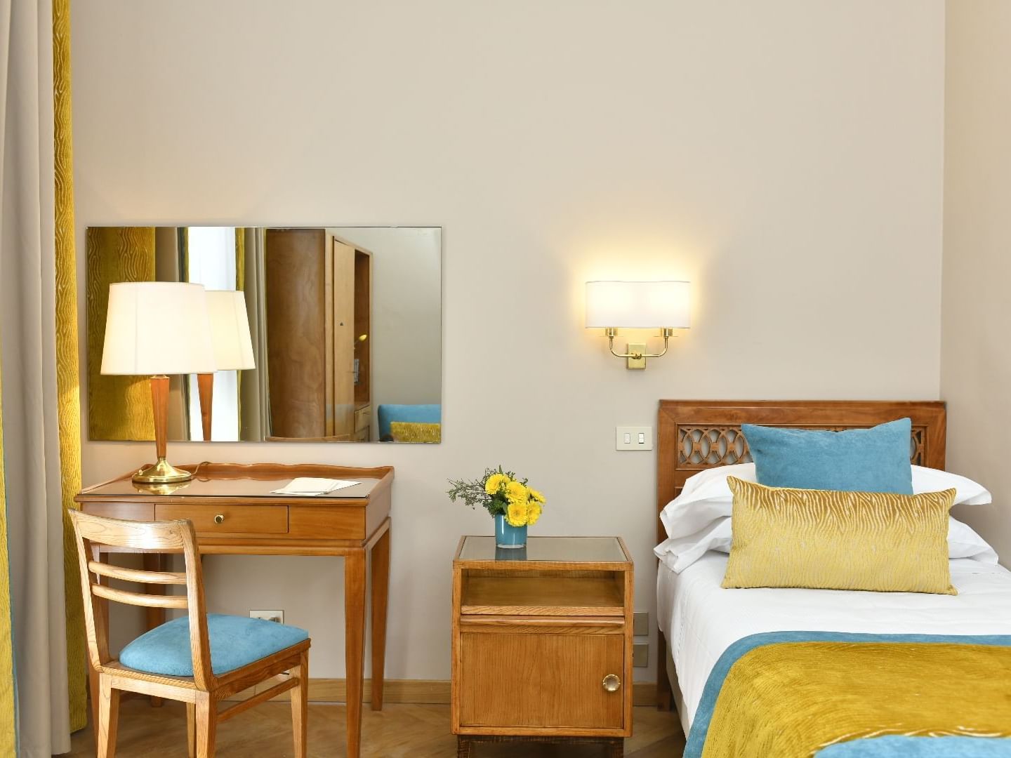 Single bed, comfy pillows, lamps & desk in Single Room at Bettoja Hotel Mediterraneo