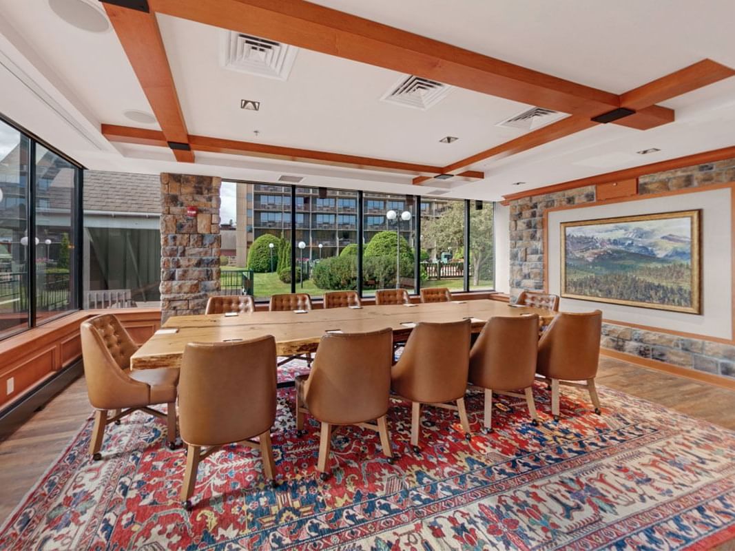 Marcy Boardroom with large conference table and chairs at High Peaks Resort