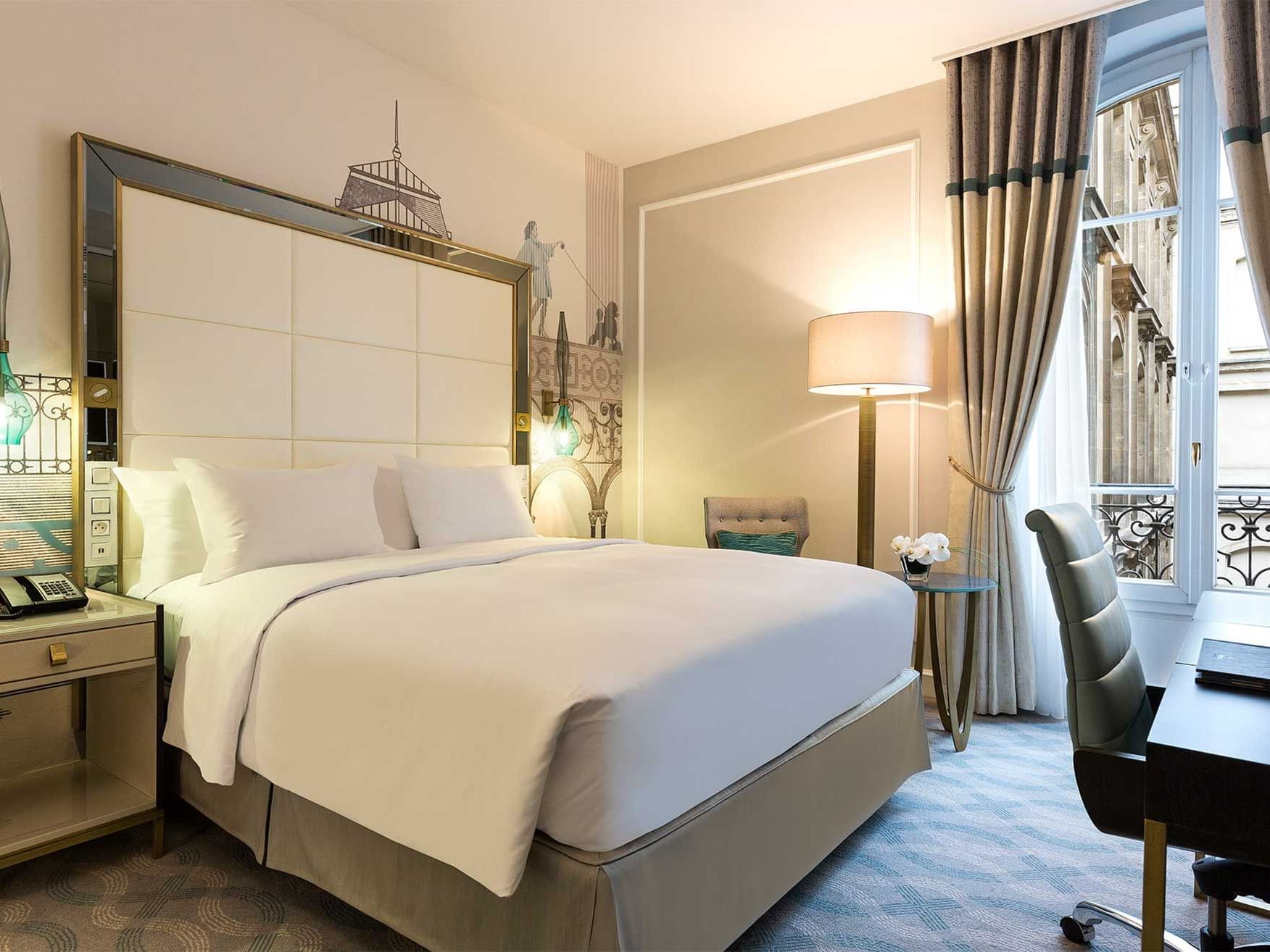 Bed & furniture in Deluxe Room at Hilton Paris Opera Hotel