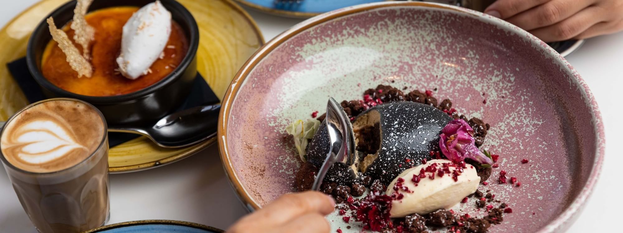 Guests enjoying desserts in The Ternary at Novotel Sydney on Darling Harbour