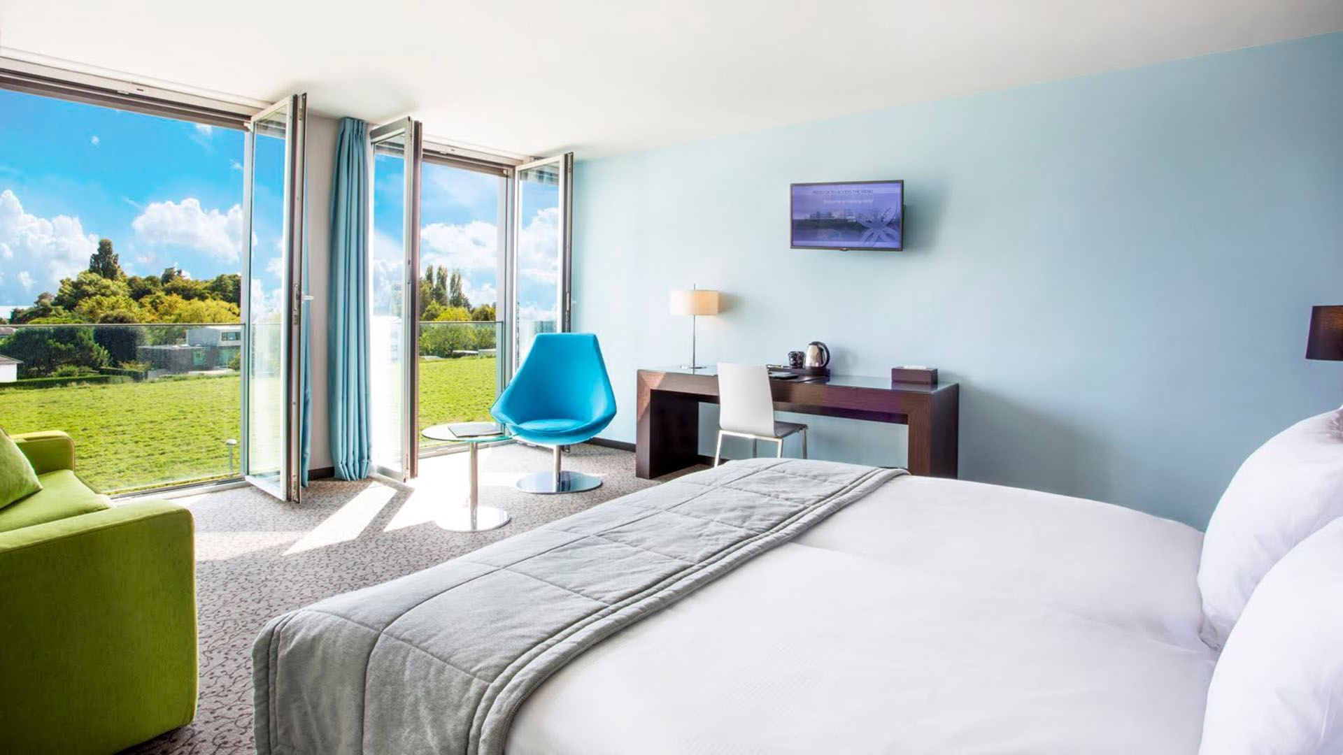 Superior Room with open windows overlooking the garden at Starling Hotel Lausanne accommodation