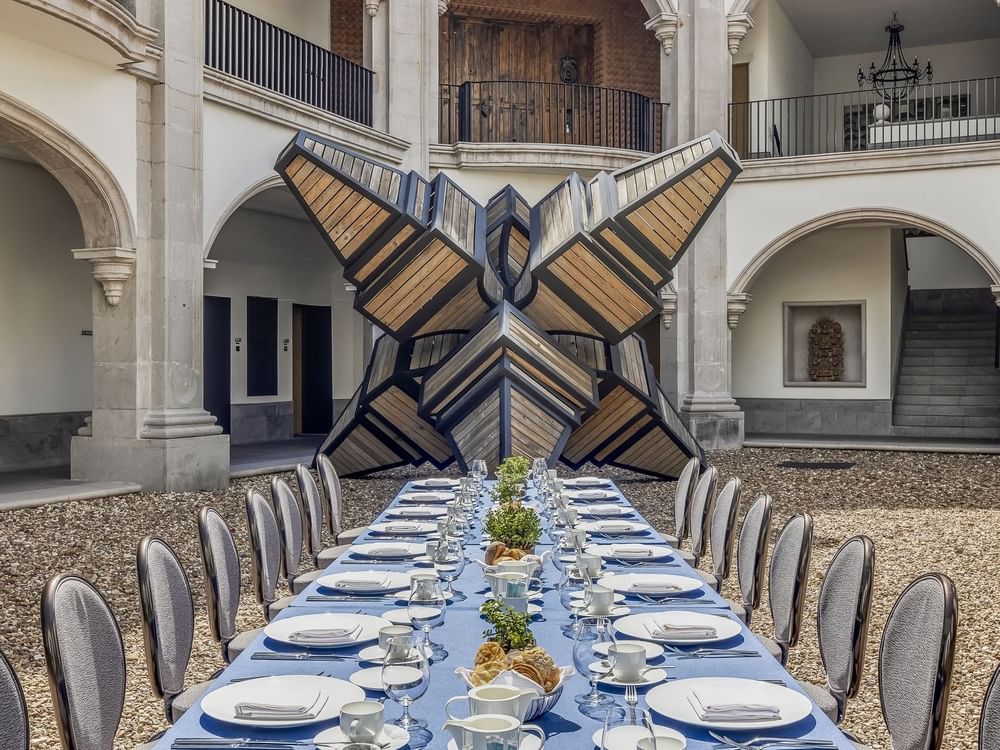 Outdoor royal banquet table arranged with glassware in  Matatena at Live Aqua Resorts and Residence Club