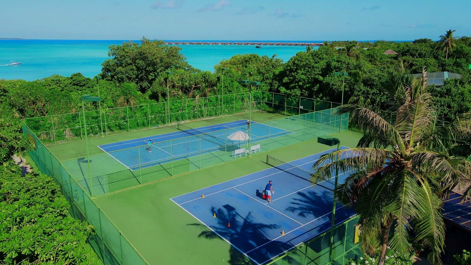 Distant view of the tennis court at The Signature Collection