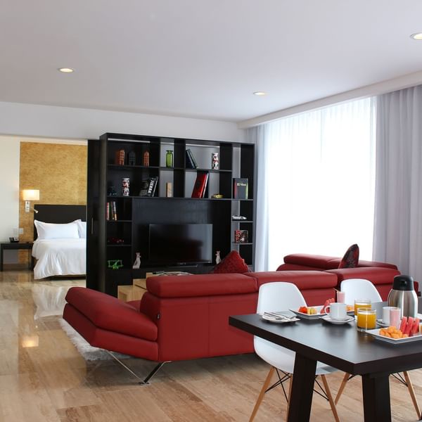 Living & dining area of Suite Gobernador at Fiesta Inn