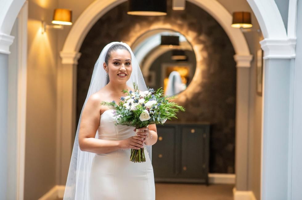 Bride posing at Gorse Hill Hotel in Surrey