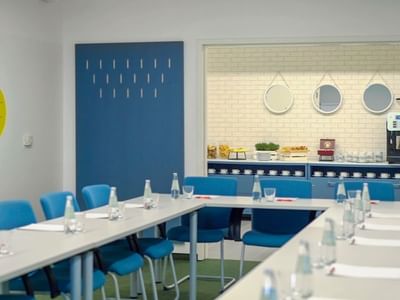 U shaped table setup in a meeting room at Metropol Hotel