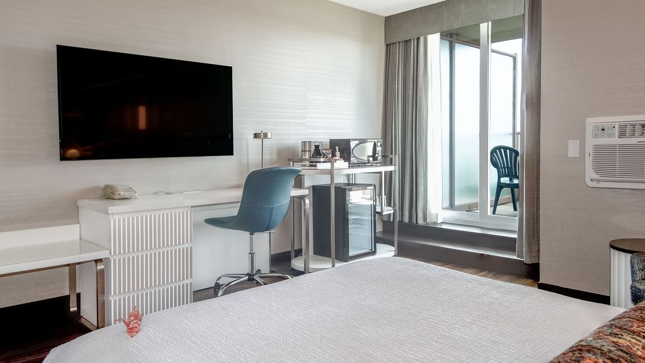 Hotel room with TV and patio