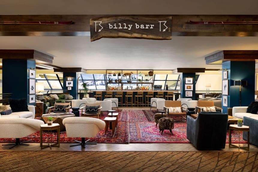 Billy Barr lounge area with several couches and tables at Elevation Resort Spa