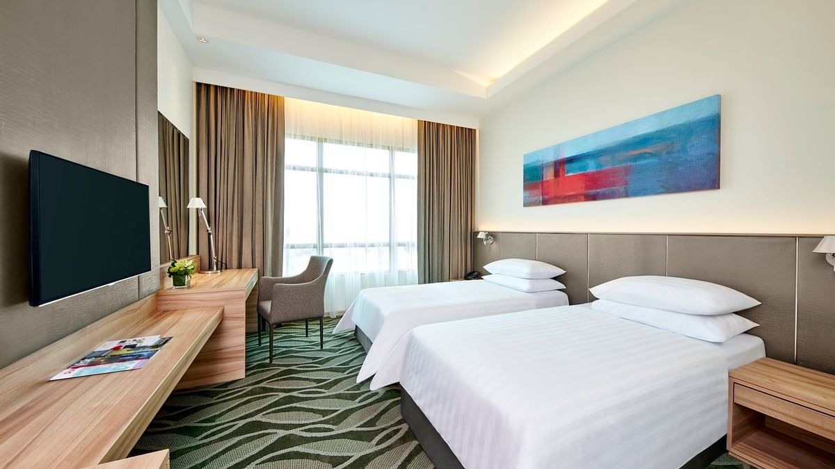 Mini work area with a TV & mirror in Deluxe King at Sunway Hotel Big Box