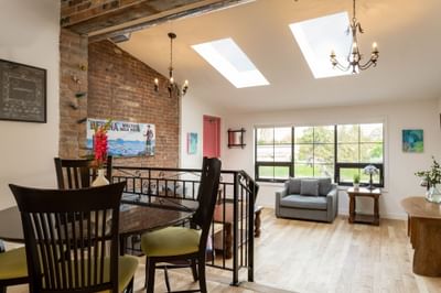 Living & dining areas in Apartment 199B at Retro Suites Hotel