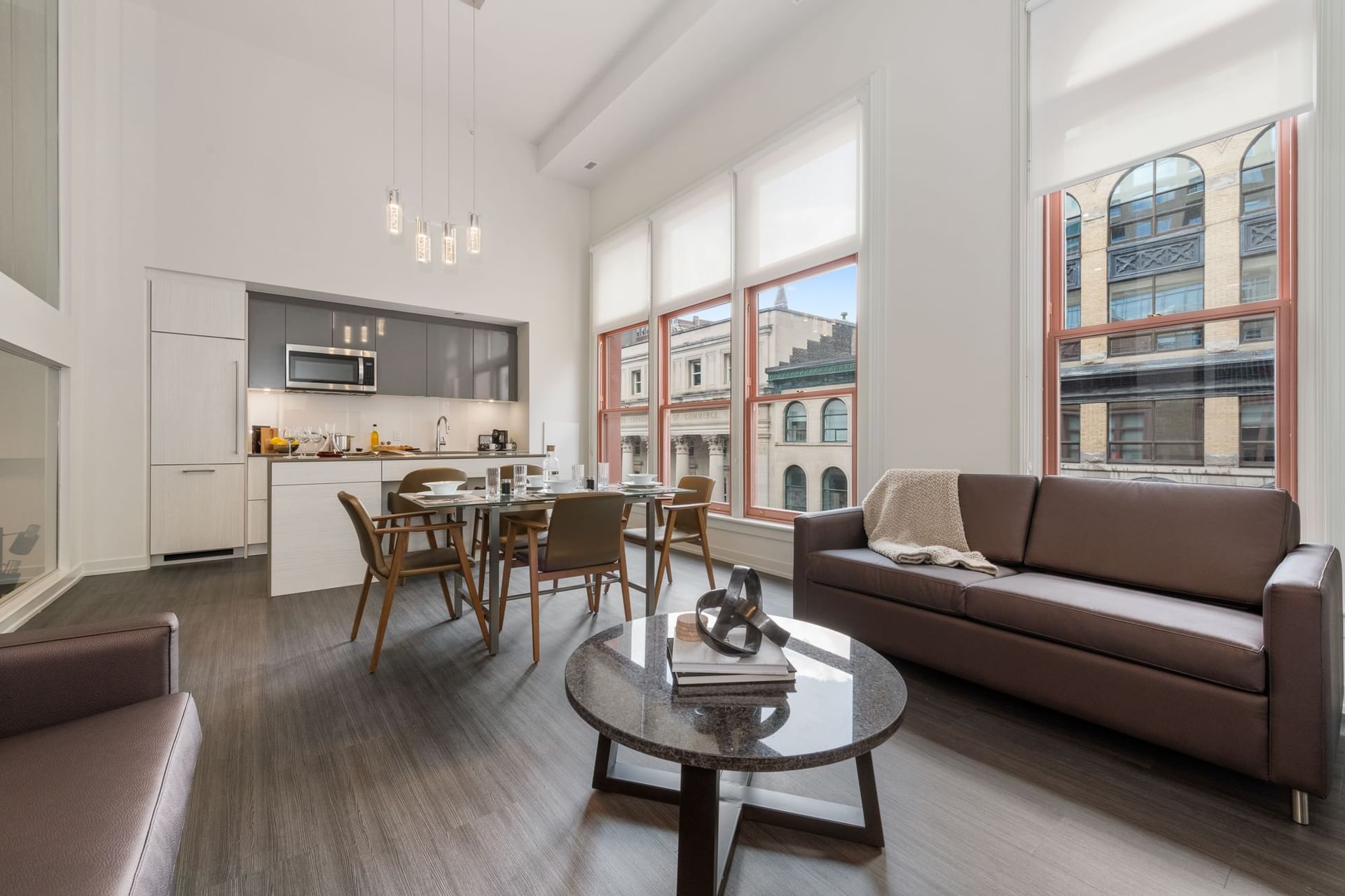 Kitchenette with dining and living area in Heritage Lofts at ReStays Ottawa