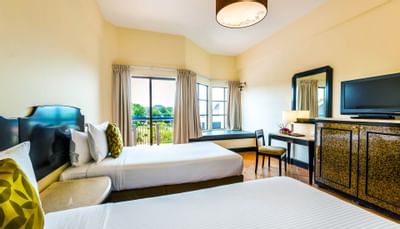 A room at Thistle Port Dickson Resort with two double beds