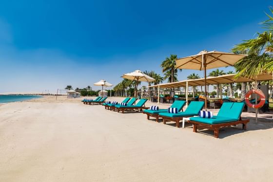 Beach Loungers and Parasols at the beach in Sealine Beach Resort