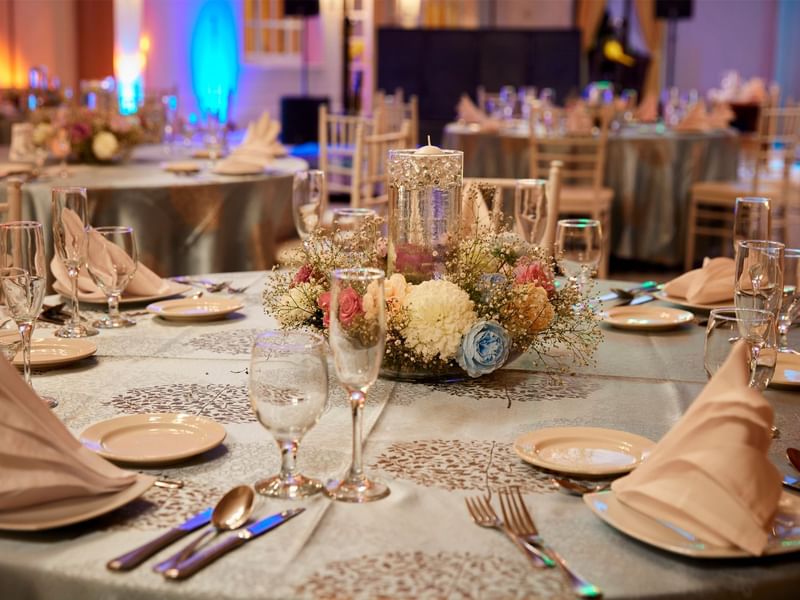 Wedding table setting with floral decor at Grand Fiesta Americana